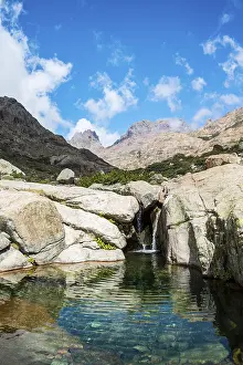 Corsica Waterfall Prints: Pool with a small waterfall in the mountains