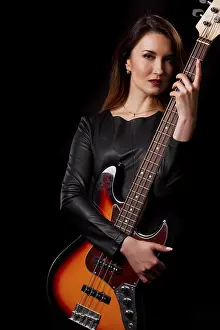 Female Musician Portrait Prints: Portrait of singer with guitar in studio
