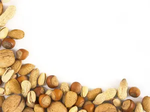Studio Shot Of Hazelnuts Prints: Background of mixed nuts in shell - hazelnuts