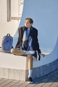 Self Confident Youth Prints: Young student with backpack in old wool coat