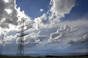 Stormy Atmosphere Prints: Power pole with cloudy sky