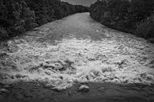 Lower Austria Nature Scene Prints: A powerful river with a strong current under a cloudy sky