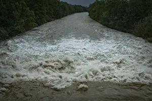 German Federal Republic Rivers Prints: A powerful river with a strong current under a cloudy sky