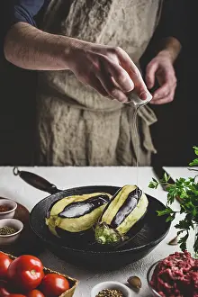Olive Oil Nutrition Prints: Preparing eggplants for baking and stuffing with ground beef and tomatoes