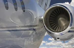 Aviation Industry Prints: Private jet and engine abstract over clouds and sky