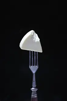 Grocery Store Dairy Products Prints: Processed cheese on fork, bitten into