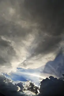 Gloomy Cloudy Atmosphere Prints: Rain clouds with sun breaking through