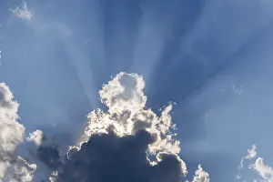 Cloudy Sky With Sunbeams Prints: Rain clouds with sun shining through