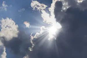 Blue Sky Atmosphere Prints: Rain clouds with sun shining through