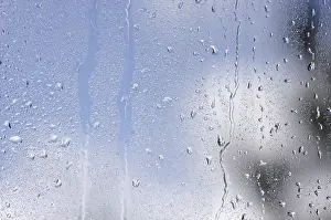 Raindrops On Window Prints: Rain drops on window as the clouds clear behind