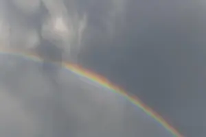 Springtime Alsace France Prints: Rainbow appears in rain clouds in spring