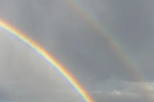 Springtime Alsace France Prints: Rainbow appears in rain clouds in spring