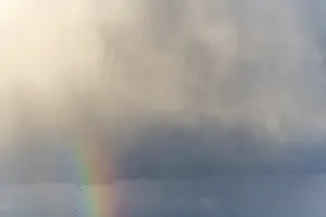 Springtime Alsace France Prints: Rainbow appears in rain clouds in spring