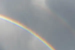 Springtime Alsace France Prints: Rainbow appears in rain clouds in spring