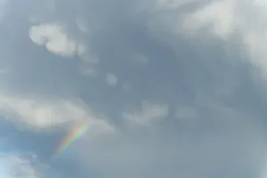 Springtime Alsace France Prints: Rainbow appears in rain clouds in spring