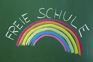 Prints of Rainbow and 'Freie Schule', German for an alternative school written with chalk on a blackboard, Germany Rainbow and 'Freie Schule' Politic Prints: Rainbow and 'Freie Schule' Print, Germany