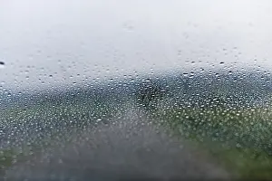 Raindrop On Glass Prints: Raindrops on a car window