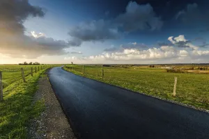 Western Europe Landscape Prints: Empty raod in farm fields in Normandy