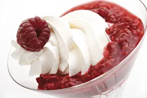 Studio Shot Sweets Prints: Raspberry puree with whipped cream and a raspberry on top