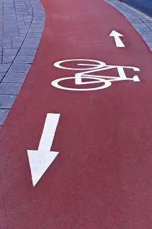 Bicycle Lane Markings Prints: Red cycle path with white markings