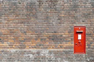 Red Brick Wall Prints: Red mail box in a brick wall