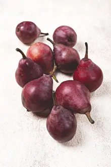 Fresh Pears Prints: Red pears scattered on the table