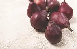 Fresh Pears Prints: Red pears scattered on the table