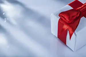 White Background Gift Box Prints: Red present box on white background horizontal image