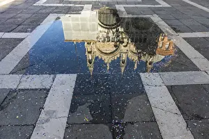 Historic City Center Photography Prints: Reflection in a puddle with confetti from the carnival