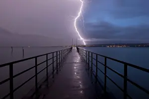 Thunderstorm Lake Constance Prints: Retreating thunderstorm, left, and magic hour with lightning