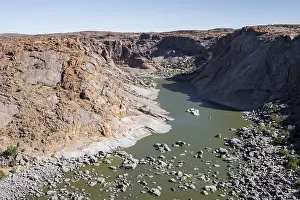 Uninhabited Waterfront View Prints: River bed and dump on the Orange River