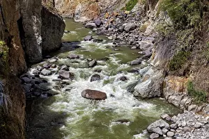 Waterfall In The Mountains Prints: River with fast rapids flanked by rocks