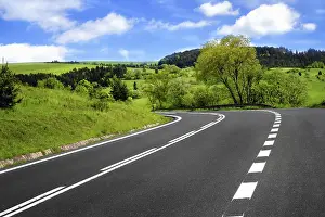 Deserted Roadway Prints: Road and cloudy sky