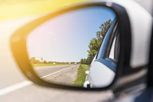 Deserted Highway Prints: Road reflected side mirror