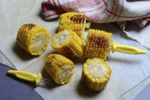 German Food Images Prints: Roasted corn on the corn cob with corn on the cob holder