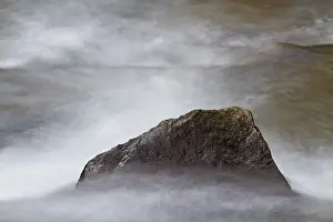 Deserted Beach Prints: Rock on water