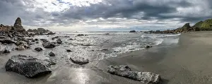 Cloudy Coastal Landscape Prints: Rocks on the beach, rain clouds