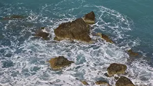 Rocky Coastline Greece Prints: Rocks in the sea, surrounded by spray and surging waves