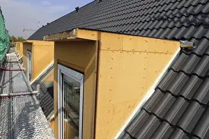 Stainless Steel Roofing Materials Prints: Roofer working on a new dormer window