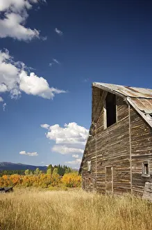 Deep Blue Sky Prints: Rustic barn scene with deep blue sky and clouds