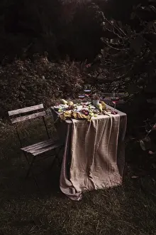 Fresh Fruit Arrangement Prints: A rustic outdoor table set with an array of snacks