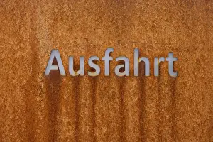 Rusty Metal Surface Prints: Rusty metal surface with the word exit in modern script