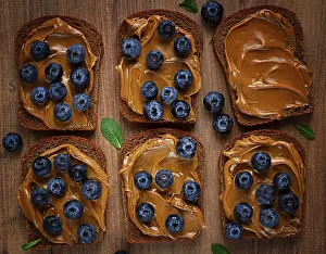 Nutritious Breakfast Prints: Rye bread with peanut paste and fresh blueberries