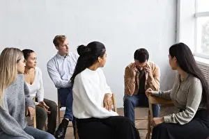 Group Therapy Session Prints: Sad man talking about his issues group therapy session