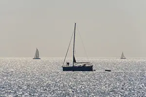 Coastal Area Evening Atmosphere Prints: Sailing ship, back light, reflections