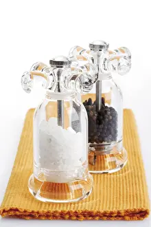 Spice And Nutrition Prints: Salt and pepper mill on orange table setting