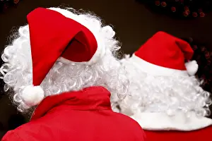Father Christmas Costume Prints: Two santas, viewed from behind