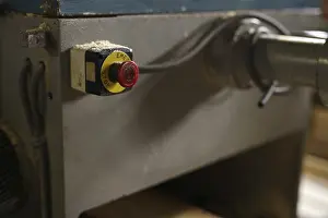 Industrial Building Architecture Prints: At sawmill. Image of stop button on machine
