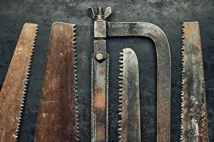 Copy Space Hints Prints: Saws on metal surface. Rusty tools for maintenance