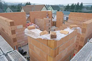 Mountainous Landscape Photo Prints: Scaffolded detached house in shell construction